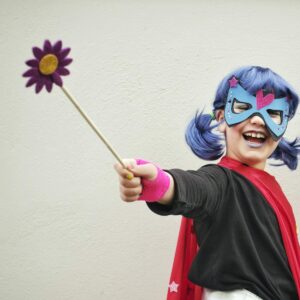 woman in black and red long sleeve shirt with blue and purple hair