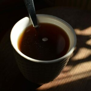 A cup of coffee with a spoon